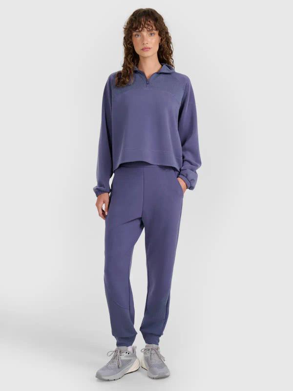 4F spodnie dresowe damskie z kieszeniami 4FWAW25TTROF1180 niebieskie (XL)
