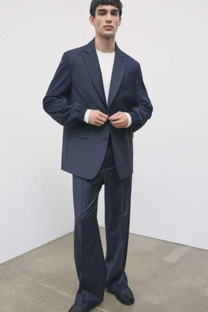 Oversize’owe spodnie z mieszanki wełny w prążki