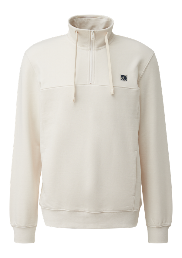 Bluza z rozciętymi kieszeniami i naszywką z etykietą